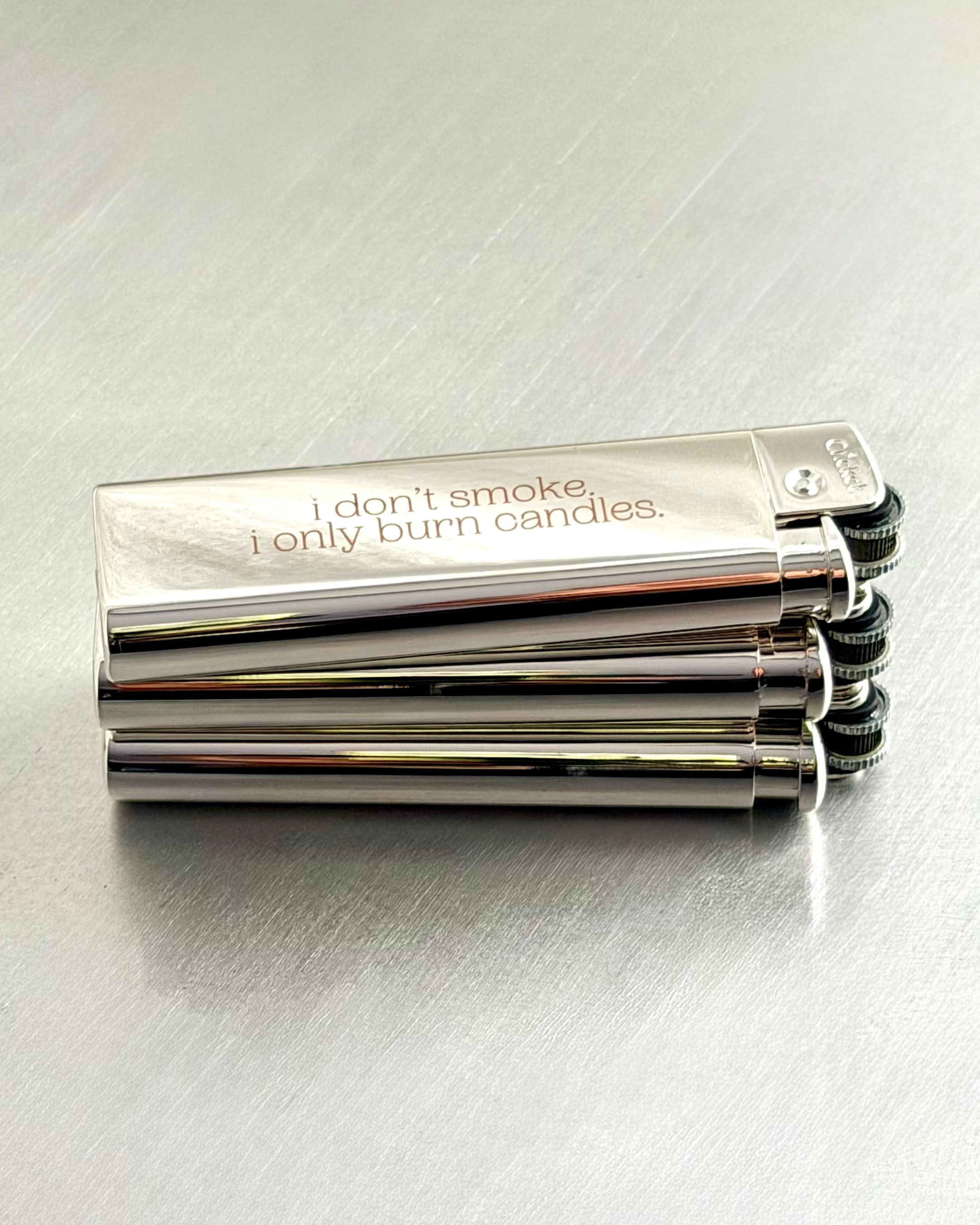 Chrome Lighters - i don't smoke, i only burn candles.